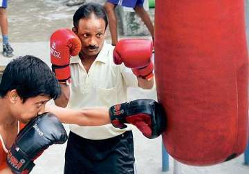 sweeper boxer seeks a job of dignity from mamata govt