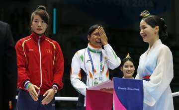 asian games boxer sarita devi refuses to wear bronze medal