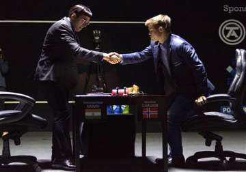 anand makes easy draw but carlsen closer to title