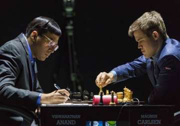 anand draws again carlsen inches closer to title