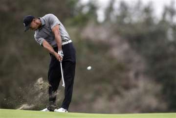 world challenge golf spieth stays in lead woods loses more ground