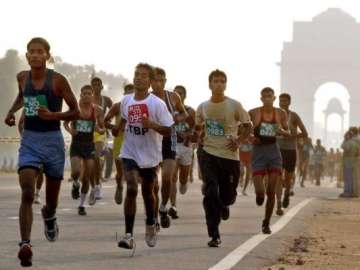 delhi half marathon suresh preeja crowned victors among indians