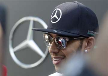 hamilton shrugs engine problem tops malaysian gp practice