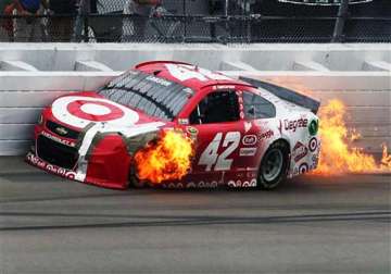 kyle larson quickly exits car after it catches fire in crash with wall