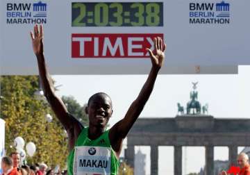 makau breaks world record in berlin marathon