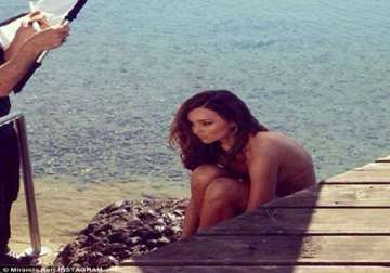 miranda kerr strips for a swimsuit shoot in freezing cold condition