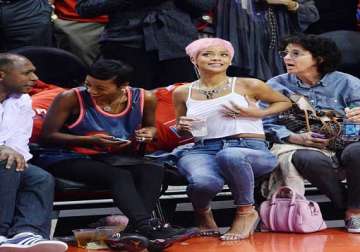 rihanna sets pulses racing with provocative display during a basket ball game