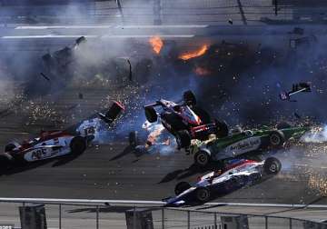 terrifying pics as indycar champion dies in ball of flames in 15 car crash