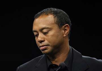 tiger woods says he s healing slowly from back surgery