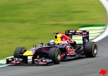 vettel wins record 15th pole at brazilian gp