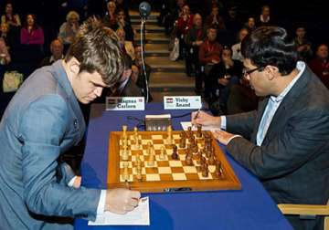 world chess carlsen again defeats anand takes two point lead