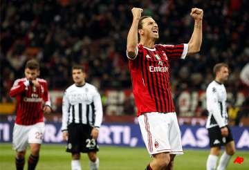 ac milan moves top with 2 0 win over siena