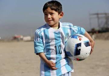 messi replaces five year old afghan boy s plastic bag jersey with a real signed one