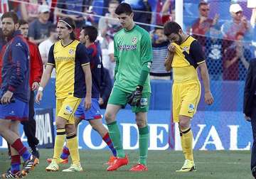 atletico madrid s loss at levante tightens spanish league title race