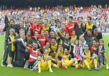 atletico madrid wins spanish title with 1 1 draw against barcelona