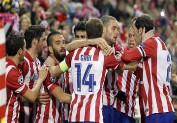 atletico beats milan 4 1 to reach champs quarters