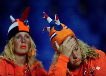 badly shaken dutch now look to 2014 world cup