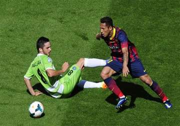 barca s title defense hit by 2 2 draw with getafe