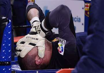 barcelona goalkeeper victor valdes tears knee ligament.