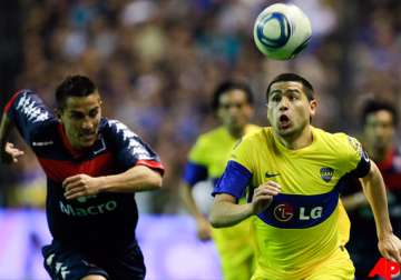 boca stays on top in argentina despite draw