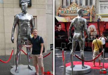 david beckham s nearly nude statue unveiled in ny
