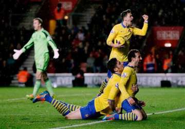 english premier league leader arsenal held as liverpool united win