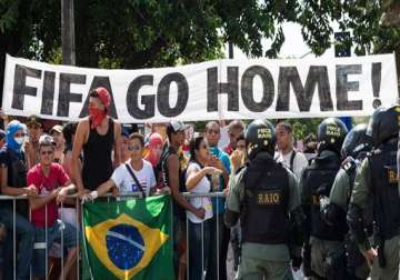 fifa world cup small band of protesters marches on rio s maracana