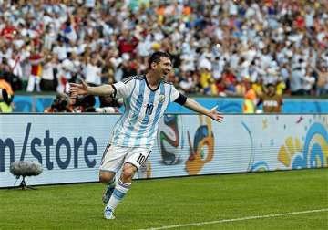 fifa world cup messi magic helps argentina top group