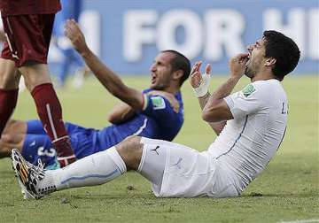 fifa world cup uruguay defends suarez as fifa scrambles