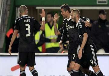 ronaldo scores to help madrid win 2 0 at elche extend lead