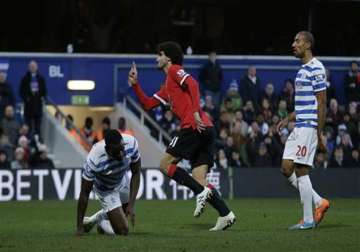 man united beats struggling qpr 2 0 in premier league