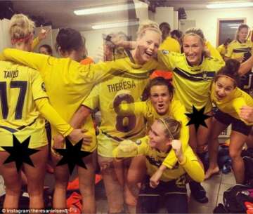 women s football team celebrate win by showing their bare backsides