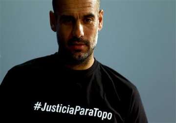 uefa charges bayern coach guardiola over t shirt statement