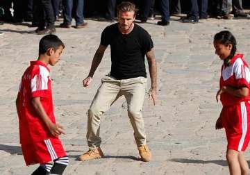 david beckham plays soccer with nepalese children
