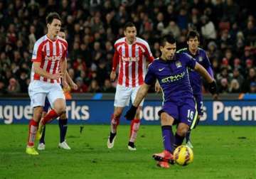 aguero s double guides man city to 4 1 win at stoke