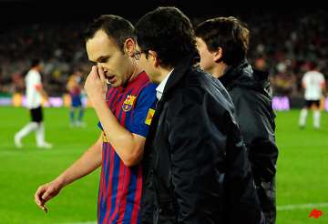 iniesta out for at least 2 weeks with thigh injury