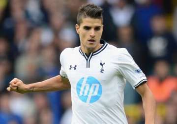 lamela steers tottenham through in europa league