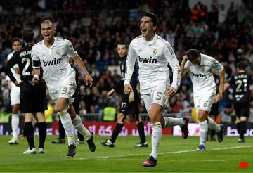 madrid eases into cup last 16 with easy win