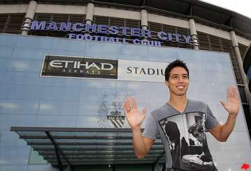 man city completes signing of nasri from arsenal