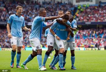 man city recovers to open title defence with win