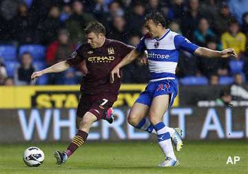 premier league man city secures 2nd place with 2 0 win at reading