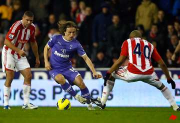 stoke dents spurs title tilt in premier league