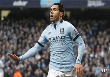 tevez charged with driving offence