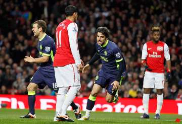 wigan beats arsenal 2 1 to boost survival hopes