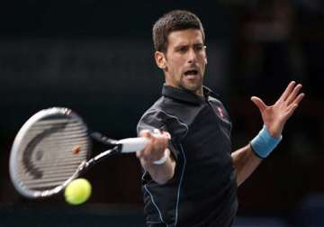 djokovic and federer advance at paris masters