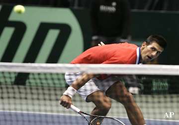 djokovic injures ankle in davis cup win over us