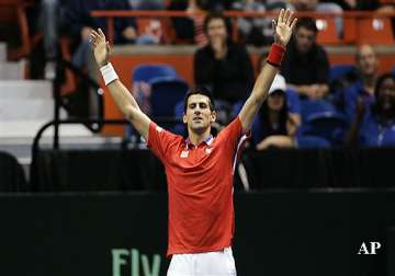 djokovic lifts serbia past us in davis cup