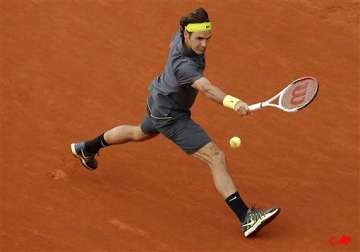 djokovic federer move on at french open