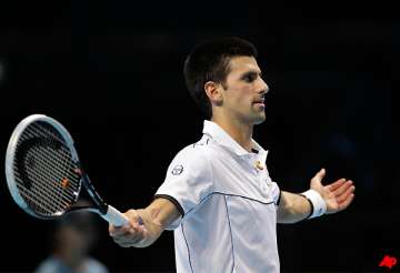 djokovic recovers to beat berdych at atp finals