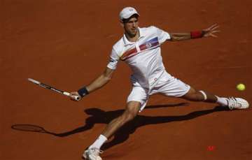 djokovic storms into quarter finals